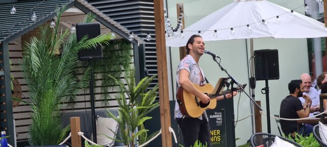 Someone playing the guitar