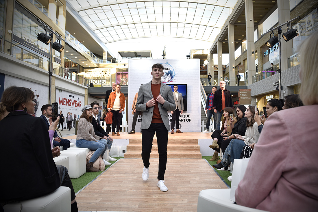 a boy in a fashion show