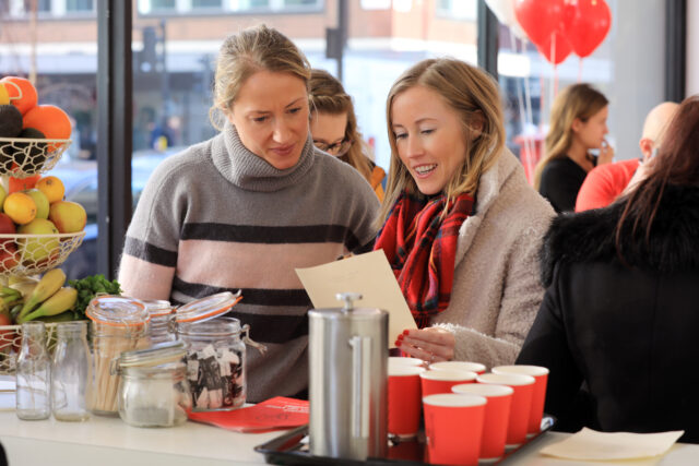 two people reading a menu