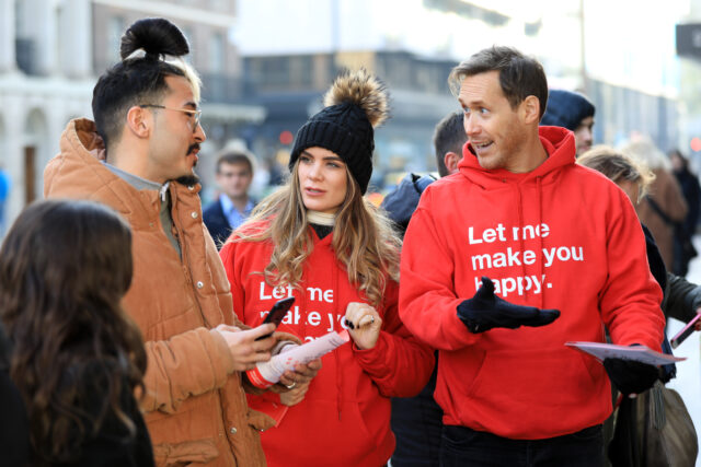 people handing out leaflets