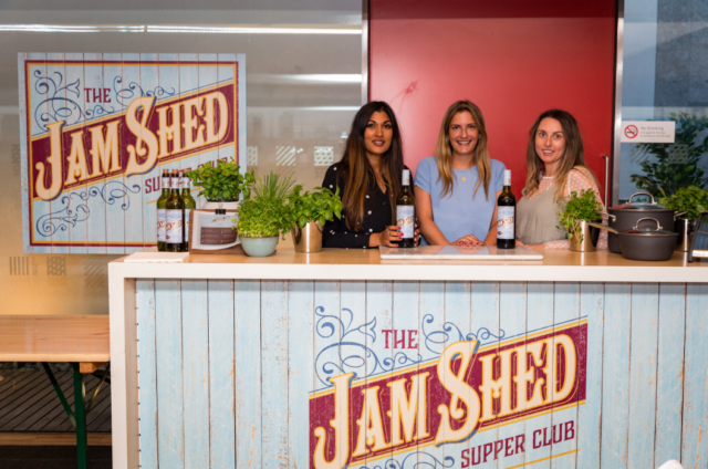 people stood behind the jam shed bar